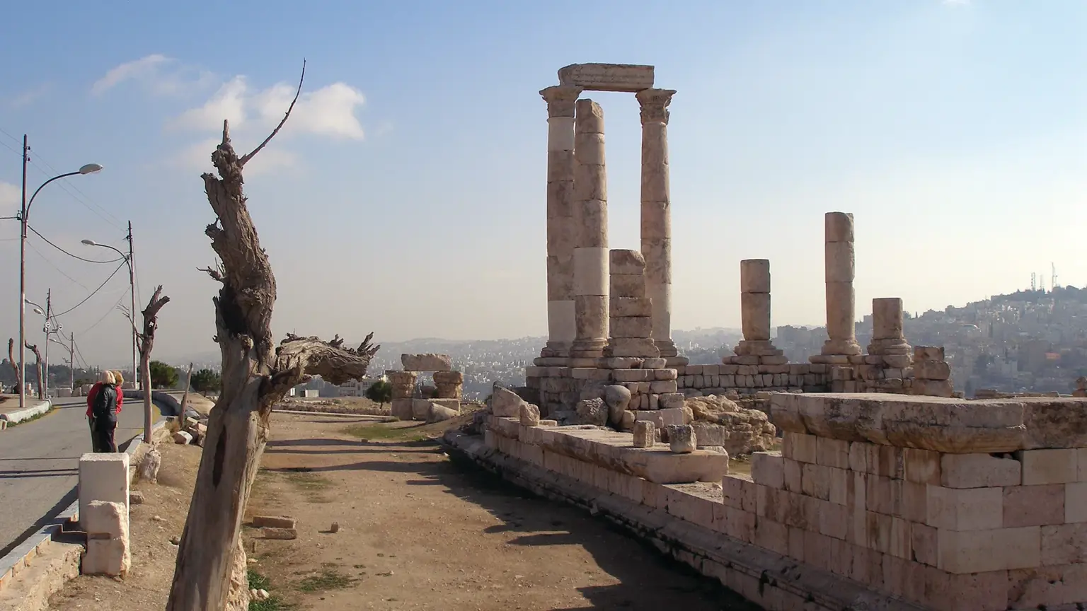The standing Roman columns of the Temple of Hercules on the Amman Citadel, overlooking the city of Amman below