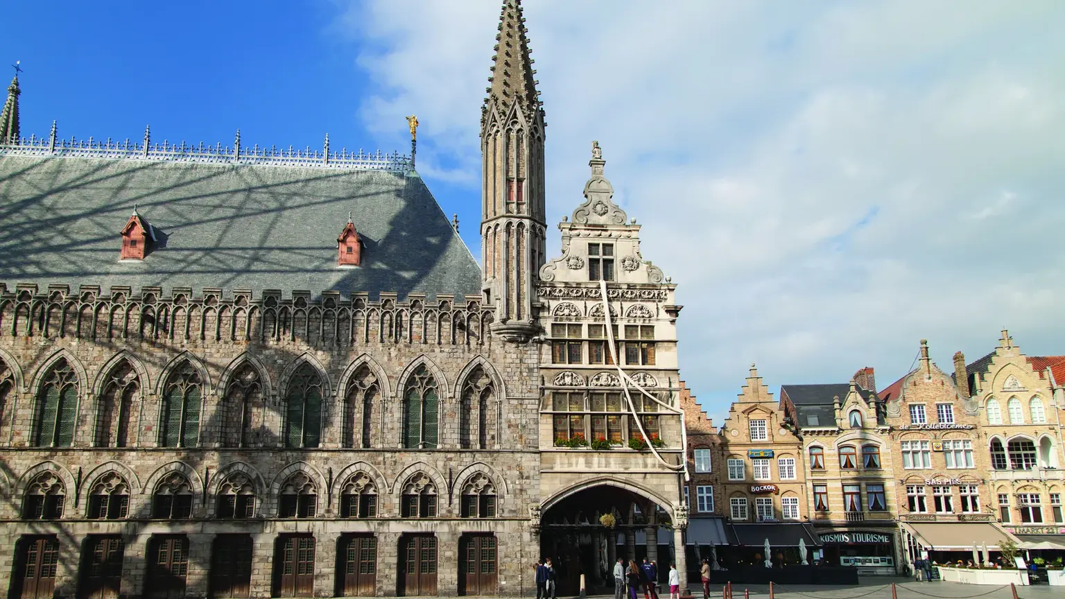 The reconstructed Gothic Cloth Hall of Ypres with its tall belfry rising above the market square