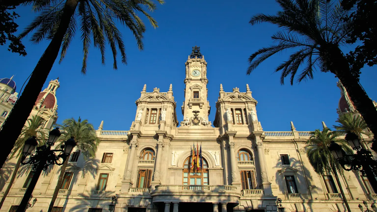 The grand baroque facade of Valencia's Town Hall overlooking the triangular Plaza del Ayuntamiento, the city's main square