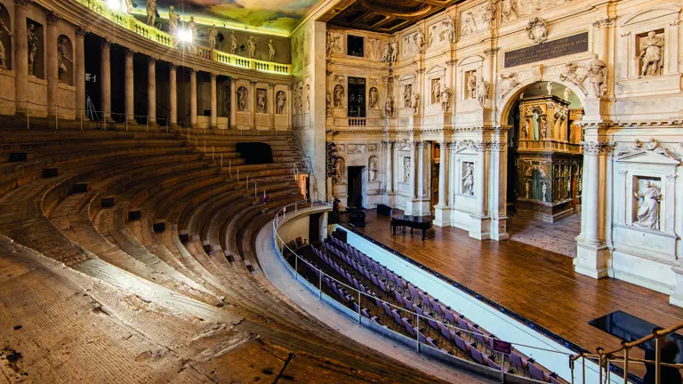 The tiered honey-stone seating inside Verona Arena, the remarkably preserved 1st-century Roman amphitheatre with a modern operatic stage on the arena floor