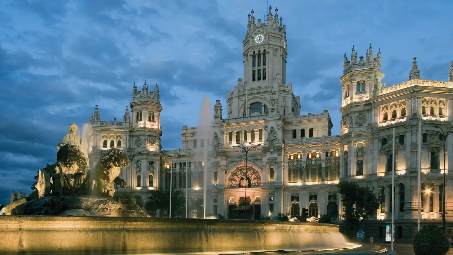 The Cibeles fountain in central Madrid, the goddess Cybele on her lion-drawn chariot, with the white Cibeles Palace behind