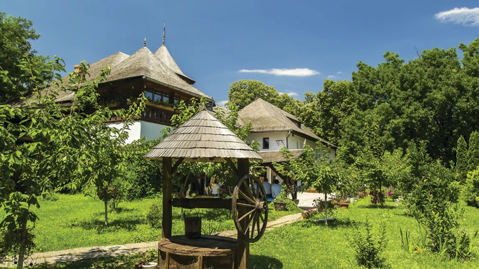 Traditional timber and thatch peasant houses re-erected in the open-air Village Museum in Bucharest