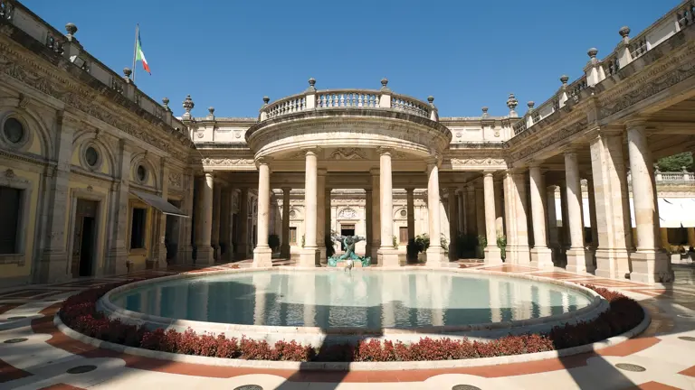 The Tettuccio thermal spa at Montecatini Terme, a white columned rotunda around a circular azure thermal pool