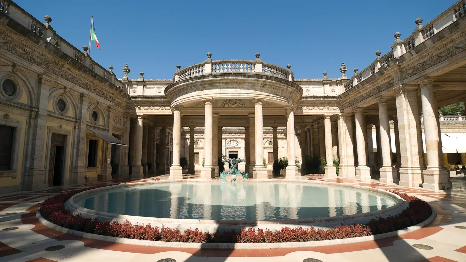 The Tettuccio thermal spa at Montecatini Terme, a white columned rotunda around a circular azure thermal pool