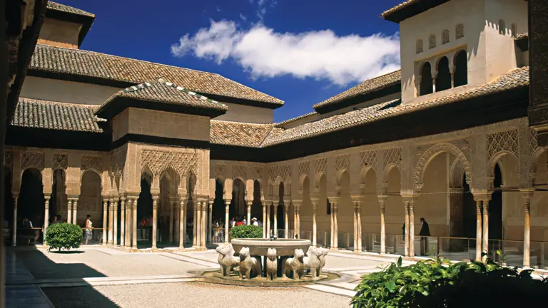 The arcaded Court of the Lions at the Alhambra in Granada, with its central marble lion fountain