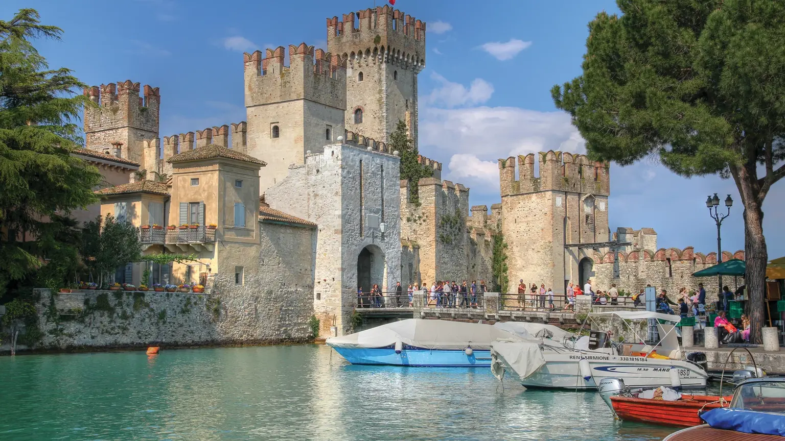 Sirmione on Lake Garda, the medieval Scaligero castle and old town on a narrow peninsula reaching into the lake's turquoise water