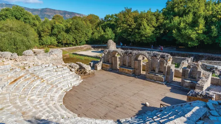 The ancient archaeological site of Butrint, Greek and Roman ruins including a theatre set among lush green woodland